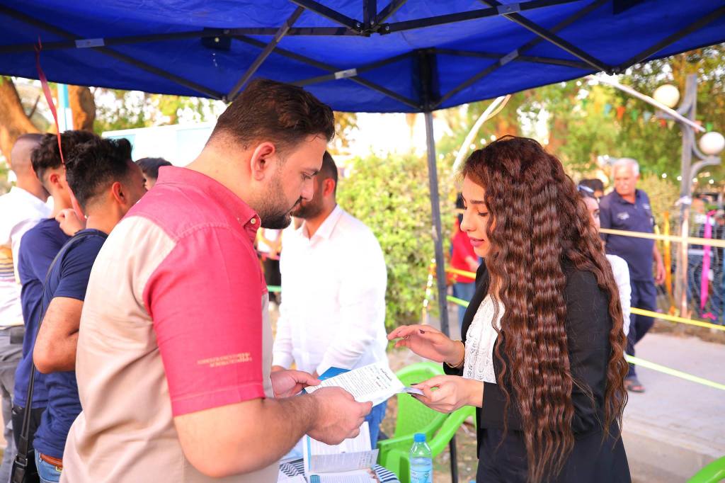 People visiting the kiosk of Trade Bank of Iraq