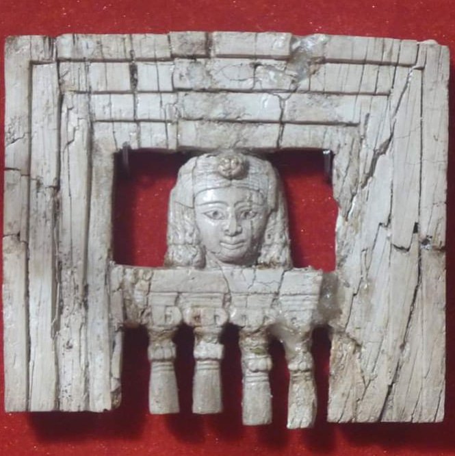 ivory plaque from Iraqi Museum, Baghdad illustrating a woman at a window